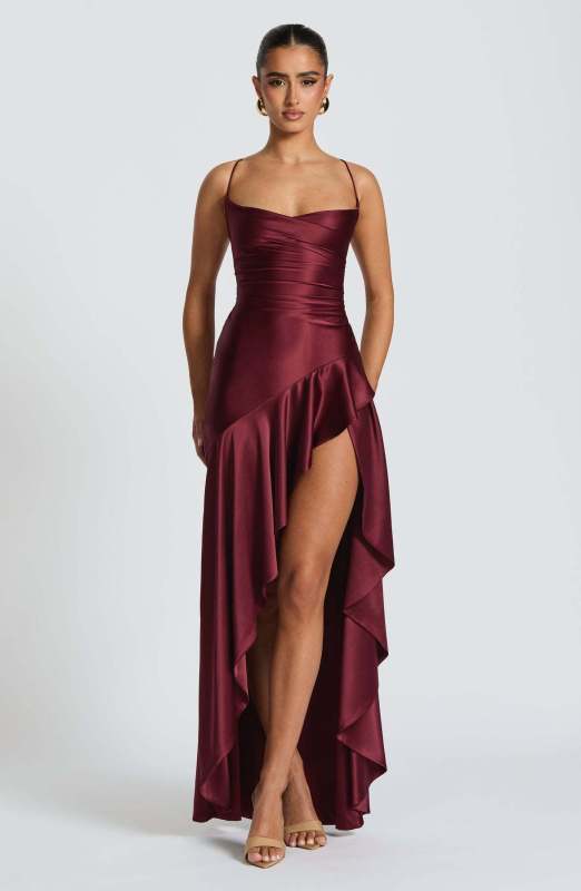 Sexy halter dress with ruffled, irregular hem.